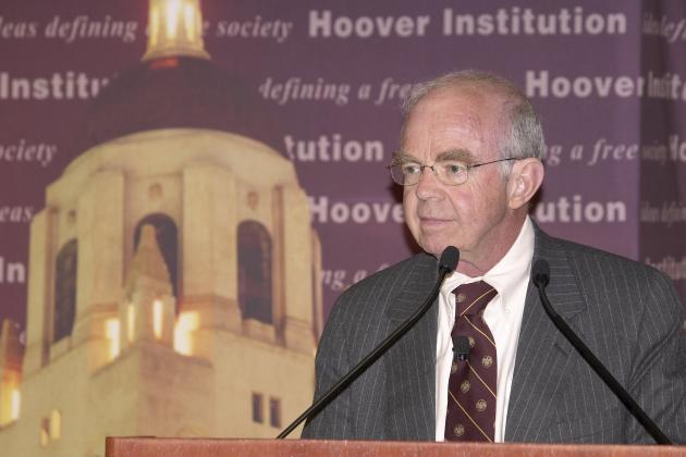 Martin Anderson speaks at the Summer Board of Overseers meeting in 2009.