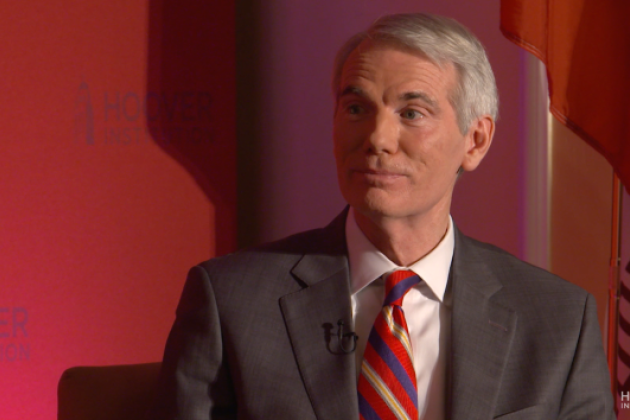 Image of Senator Rob Portman in front an orange-red background