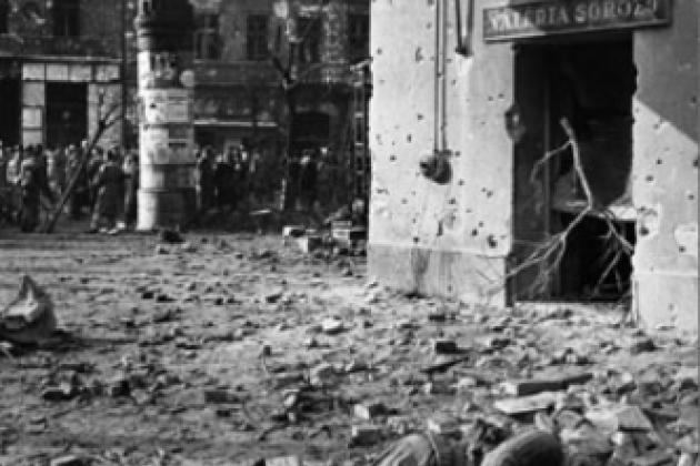 Hungarians with dead Soviet soldier in 1956 uprising