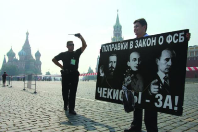 A security officer confronts a Red Square protester