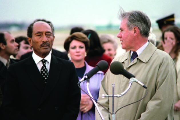 Egyptian President Anwar Sadat, left, arrives at Andrews Air Force Base in 1980