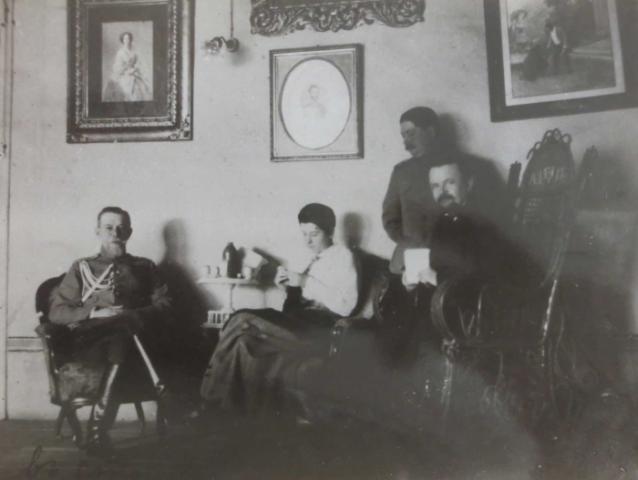Trubetskoi with group in a sitting room