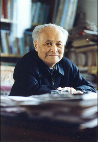 Color photograph of Li Rui at desk