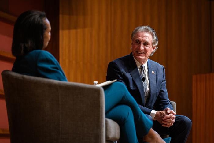 US Secretary of the Interior Doug Burgum is seen in Hauck Auditorium with Hoover Institution Director Condoleezza Rice on October 10, 2025. (Patrick Beaudouin)