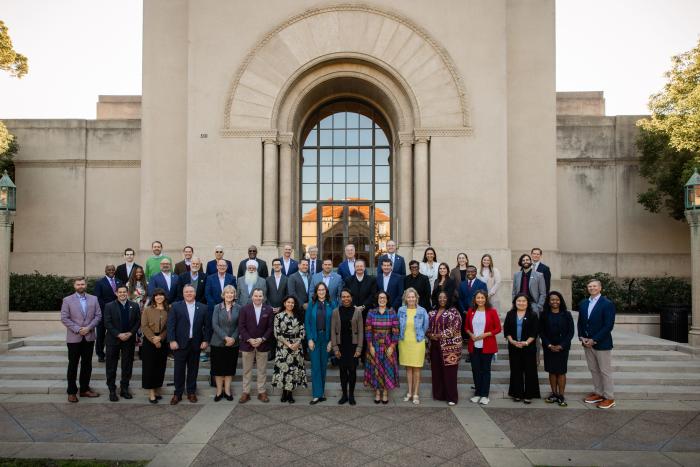 Participants in a joint Hoover–National Association of Counties gathering stand in front of Hoover Tower on December 8, 2025. (Patrick Beaudouin)