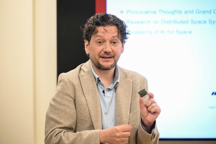 Simone D’Amico speaks to members of Congress and their staff members at an event at Stanford University on May 30, 2024. (Rod Searcey)