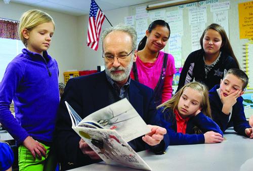 Huffman reading to schoolchildren