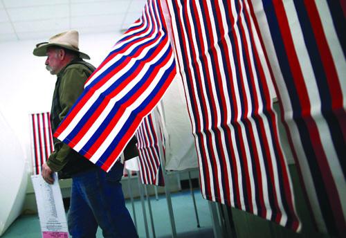 man leaves voting booth