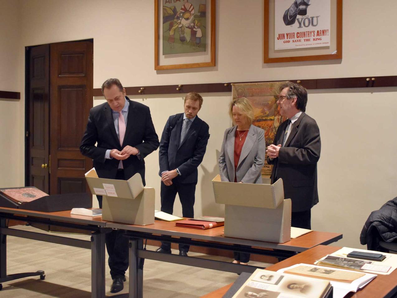 Latvian Ambassador delegation viewing library and archival material