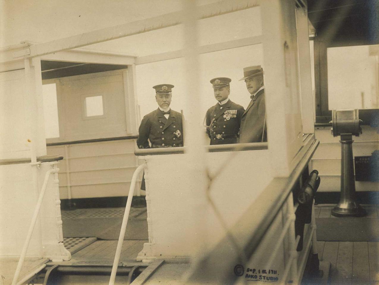 3 men standing on the deck of the Tanba Maru