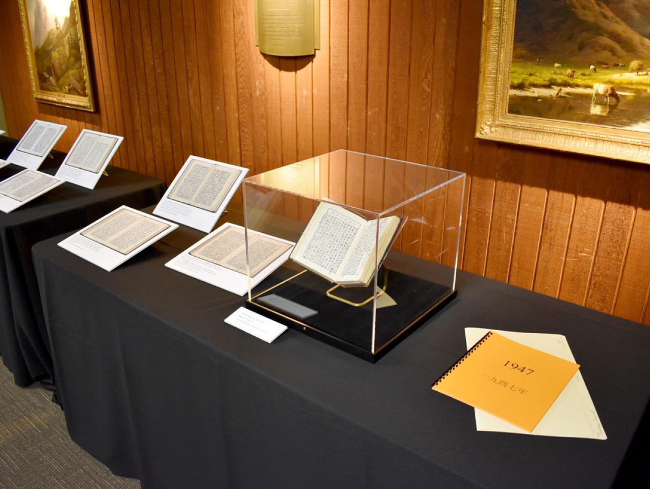 Exhibit of Chiang Ching-kuo diaries on a table with black tablecloth