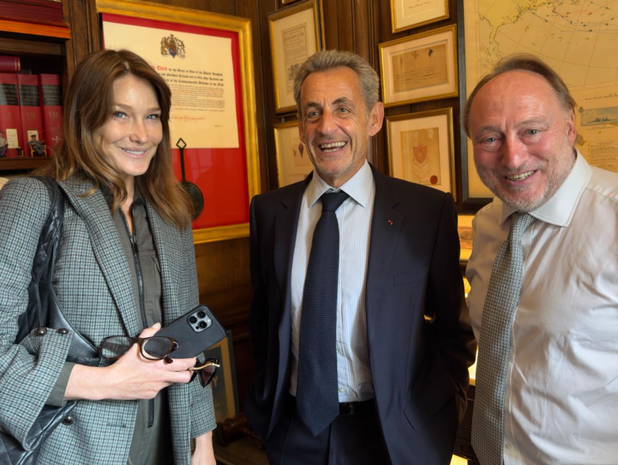 Carla Bruni, former French president Nicholas Sarkozy and Andrew Roberts are seen in London on June 4.
