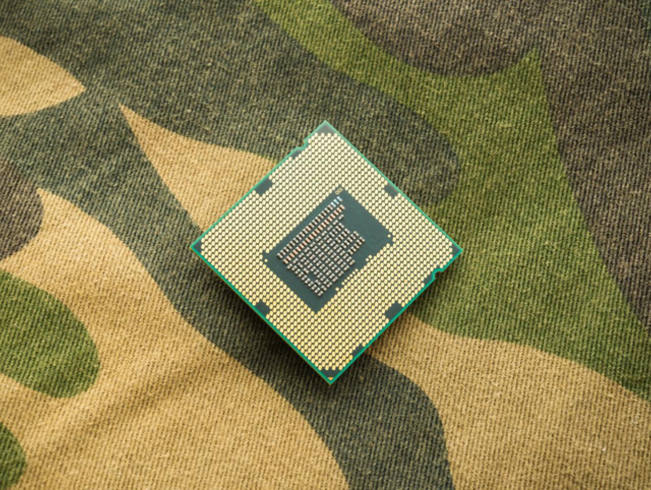 computer chip on camo background