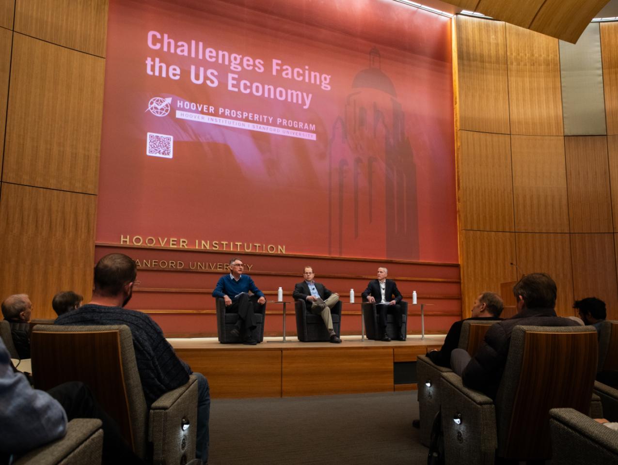 Emmanuel Saez (left), Bruce Meyer and Senior Fellow Ross Levine discuss income inequality at the Challenges Facing the US Economy Conference on January 21, 2025. (Patrick Beaudouin)