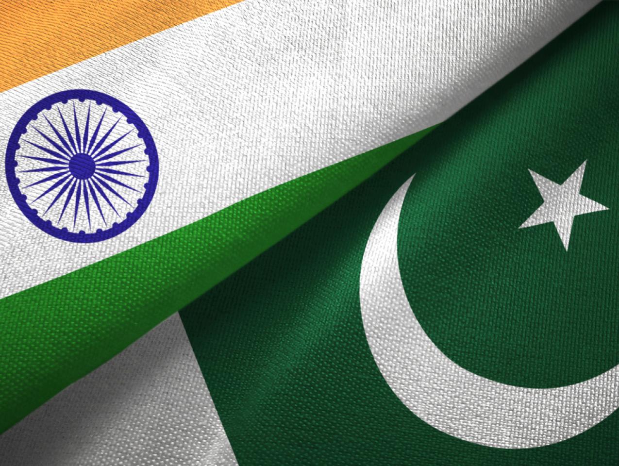 Pakistan and India two flags together textile cloth fabric texture stock photo