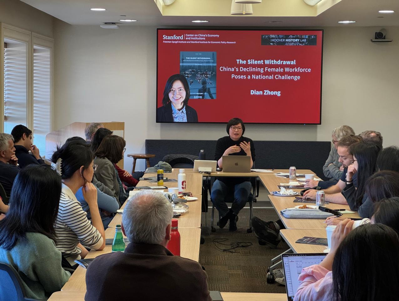 Dian Zhong speaking at an event