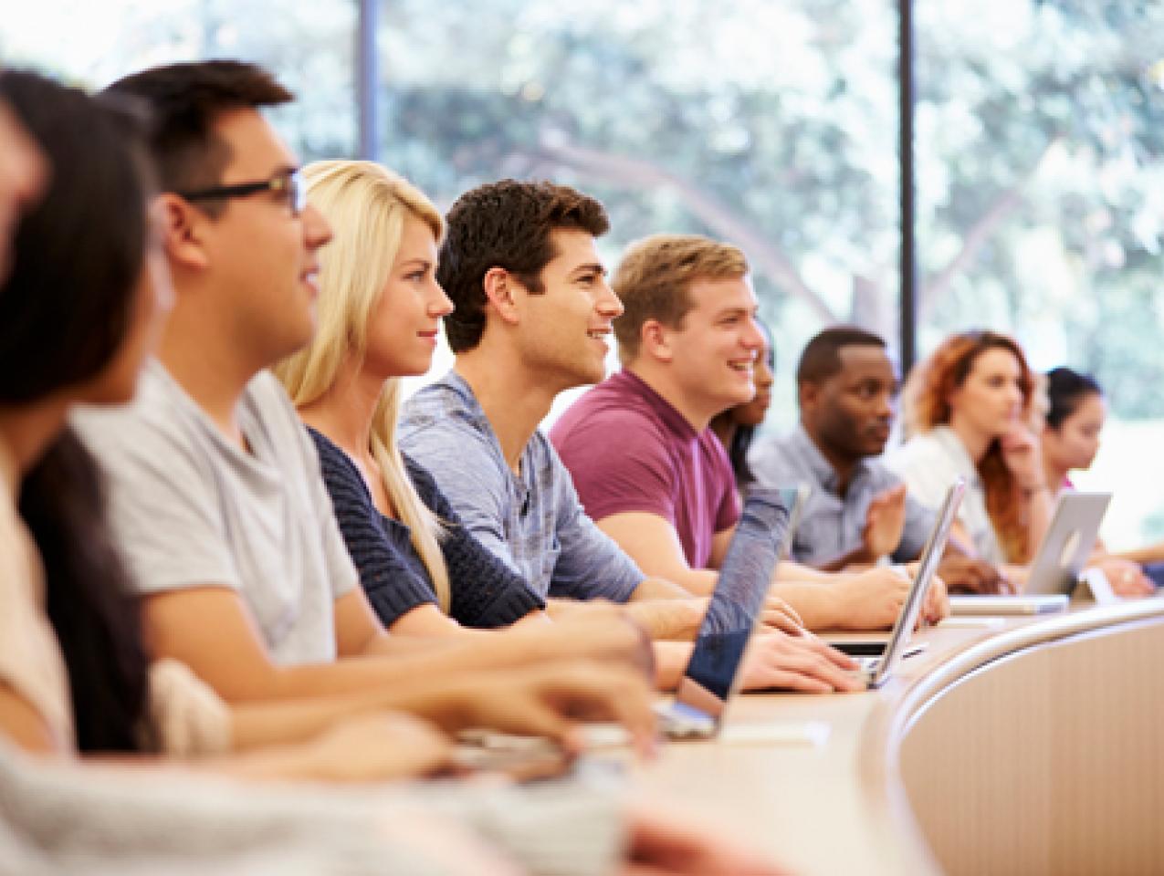 Class Of University Students Using Laptops In Lecture stock photo
