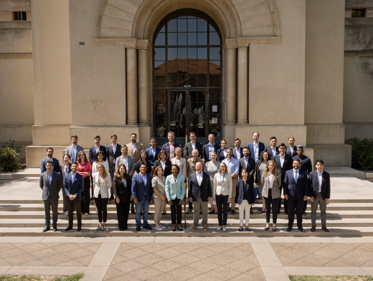 The 2025 cohort of Hoover Institution International Seminar participants are seen outside Hoover Tower with Condoleezza Rice and H.R. McMaster (center) on June 23, 2025. (Patrick Beaudouin)
