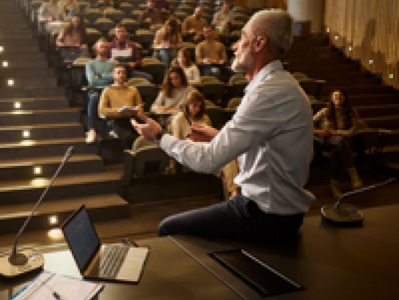 college professor with students istock image
