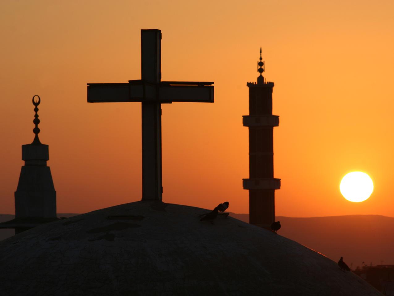 Egyptian sunrise with cross and crescents stock photo