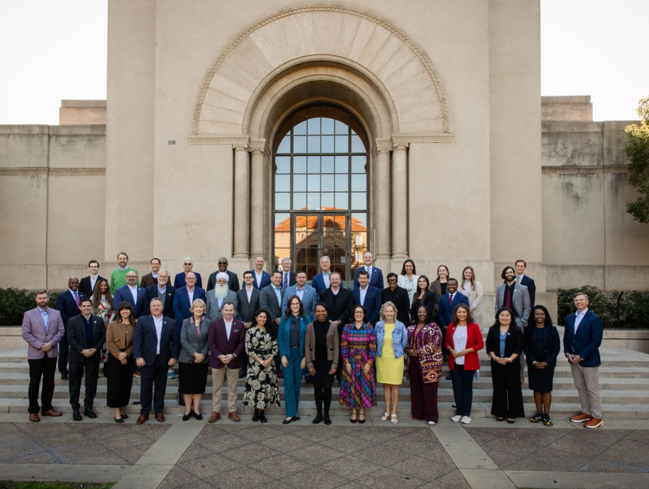 Participants in a joint Hoover–National Association of Counties gathering stand in front of Hoover Tower on December 8, 2025. (Patrick Beaudouin)