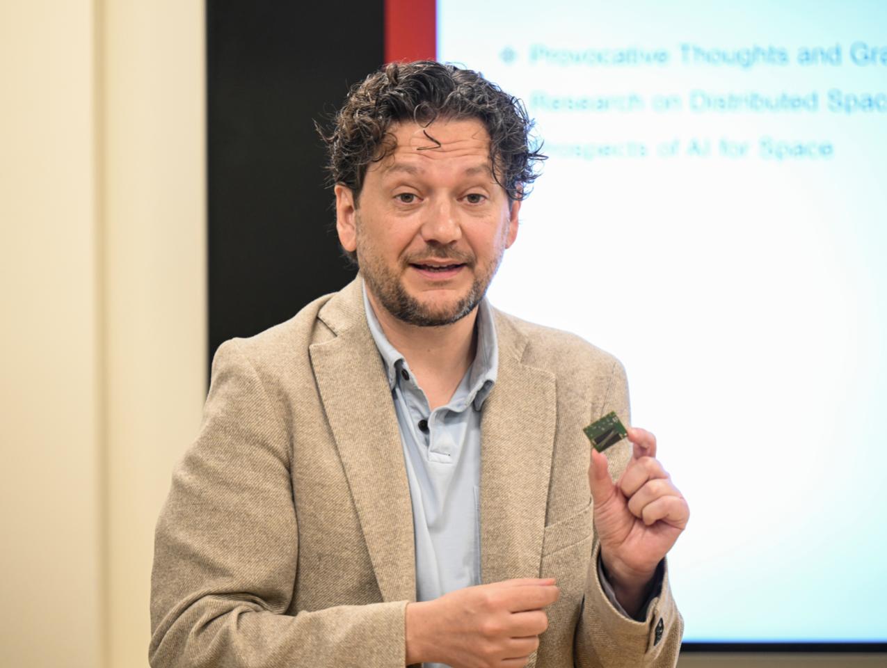 Simone D’Amico speaks to members of Congress and their staff members at an event at Stanford University on May 30, 2024. (Rod Searcey)