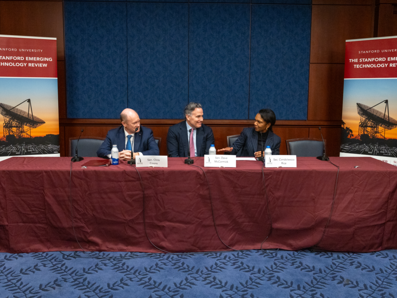 Director Rice, Senators Coons, and McCormick in conversation during their panel session.