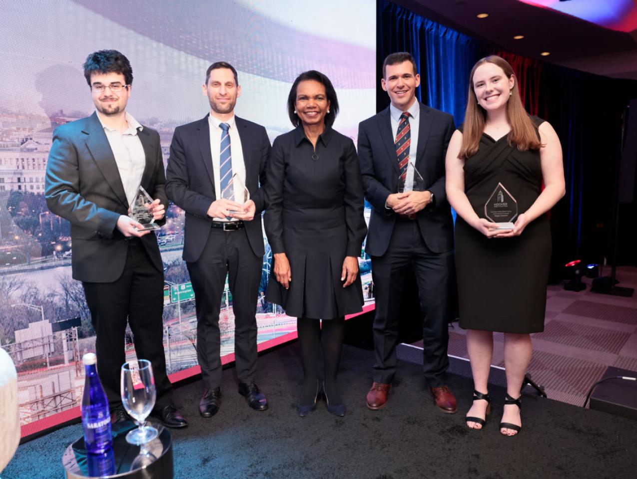Winners of the 2025 HISPBC Student Essay Competition stand with Hoover Institution Director Condoleezza Rice on February 22, 2026. (Eric Draper)