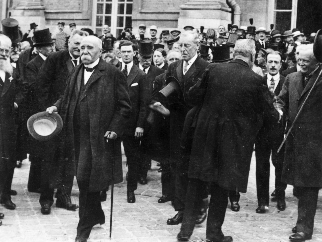 1919: French prime minister Georges Clemenceau (1841 - 1929) (L), US president Woodrow Wilson (1856 - 1924) (C) and British prime minister David Lloyd George (1863 - 1945) attend negotiations for the Treaty of Versailles. (Photo by Hulton Archive/Getty Images)