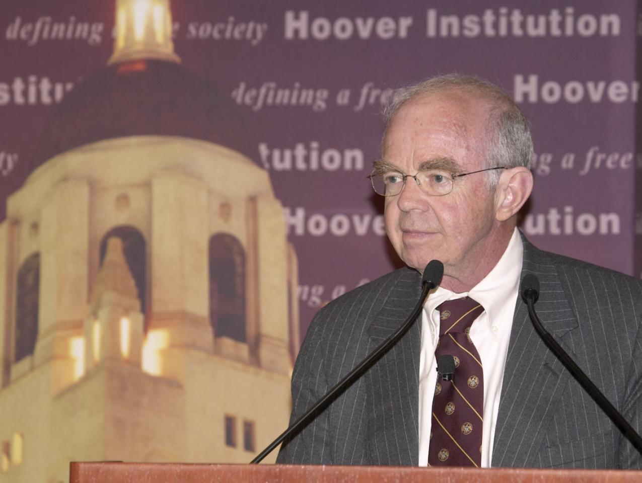 Martin Anderson speaks at the Summer Board of Overseers meeting in 2009.