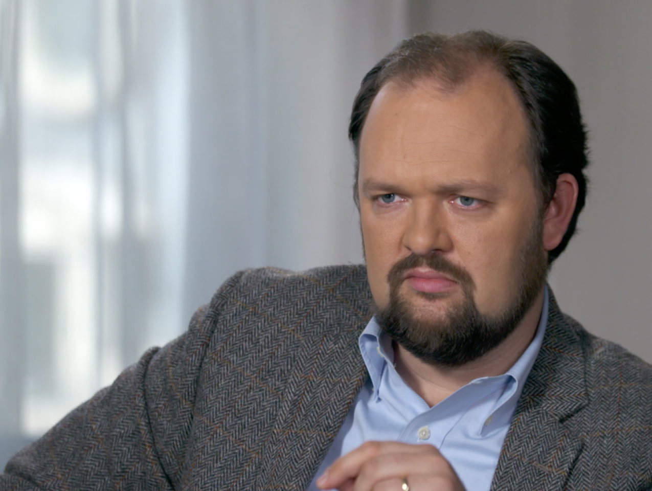 Image of Ross Douthat with a grey background