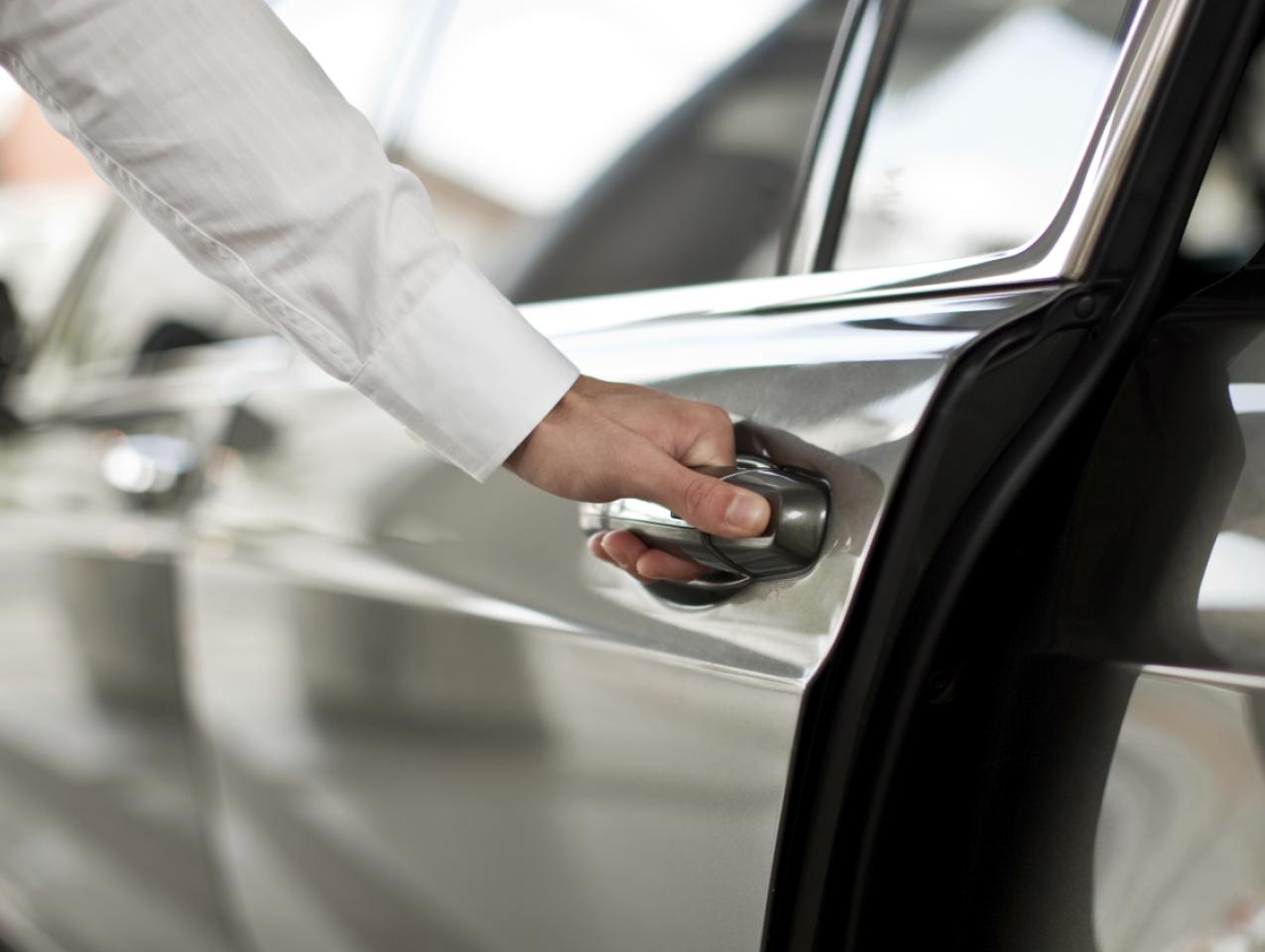 Man opening a car door