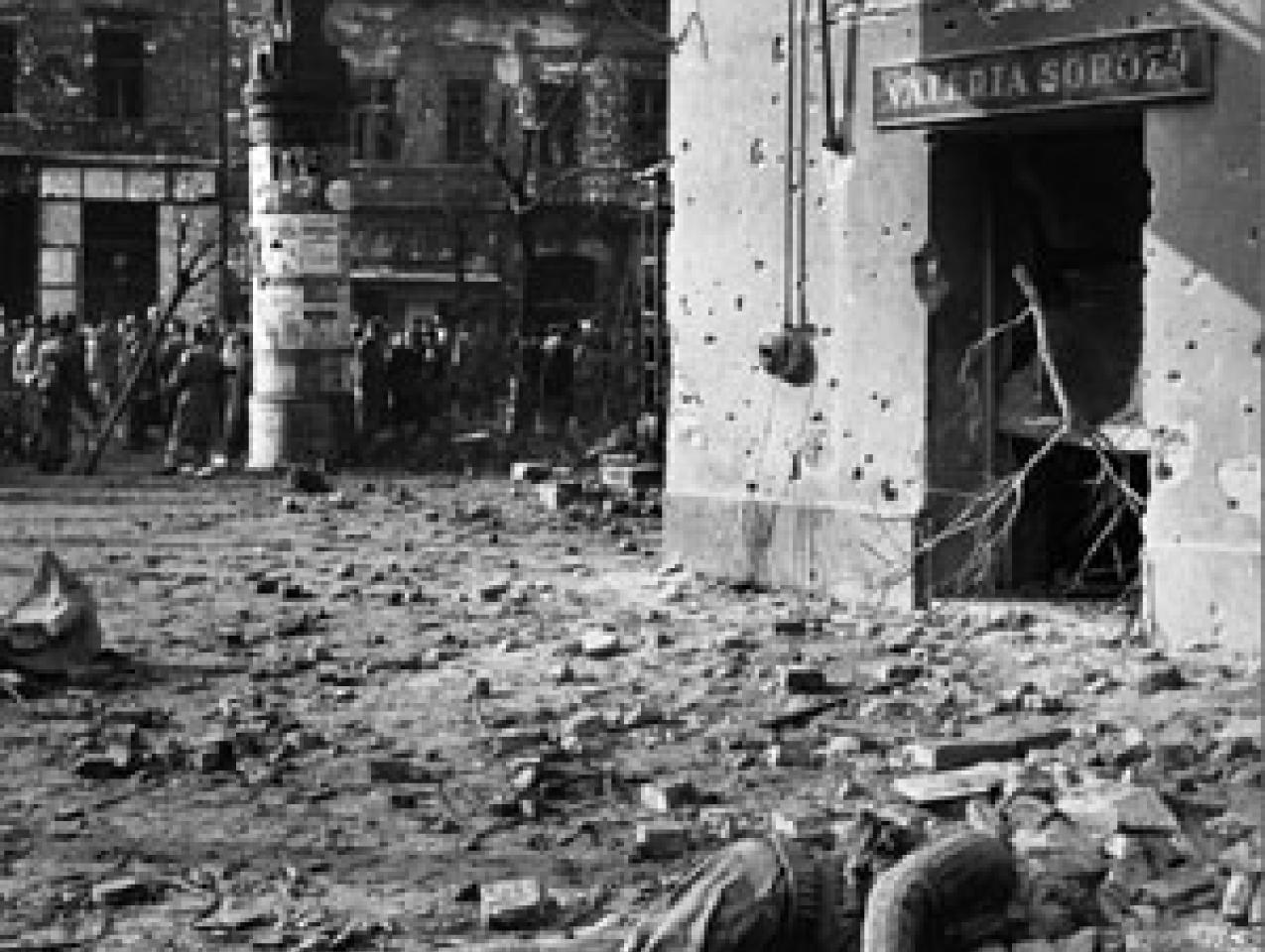 Hungarians with dead Soviet soldier in 1956 uprising