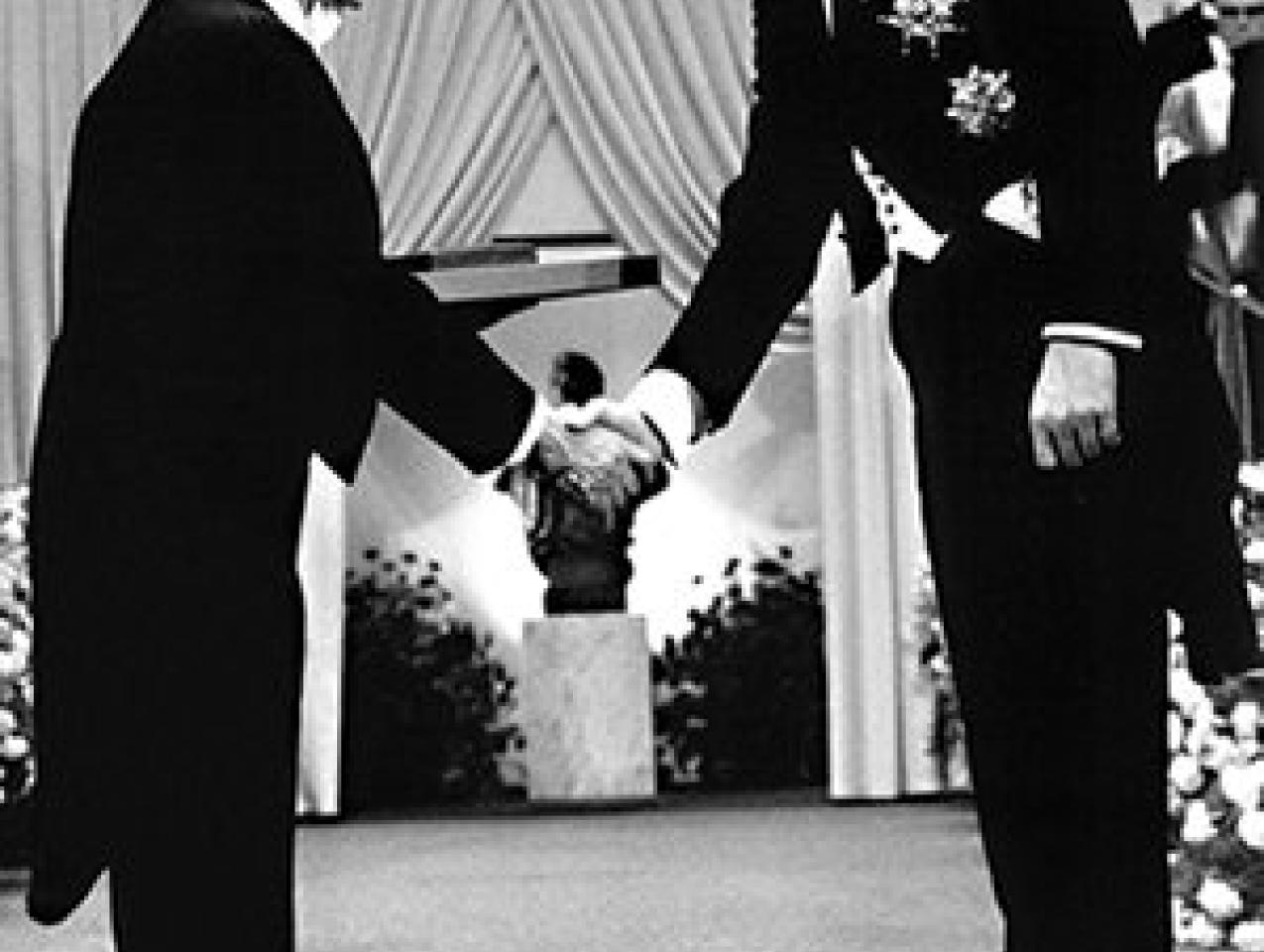 Milton Friedman receives the 1976 Bank of Sweden Prize in Economic Sciences in Memory of Alfred Nobel from King Carl XVI Gustaf of Sweden.