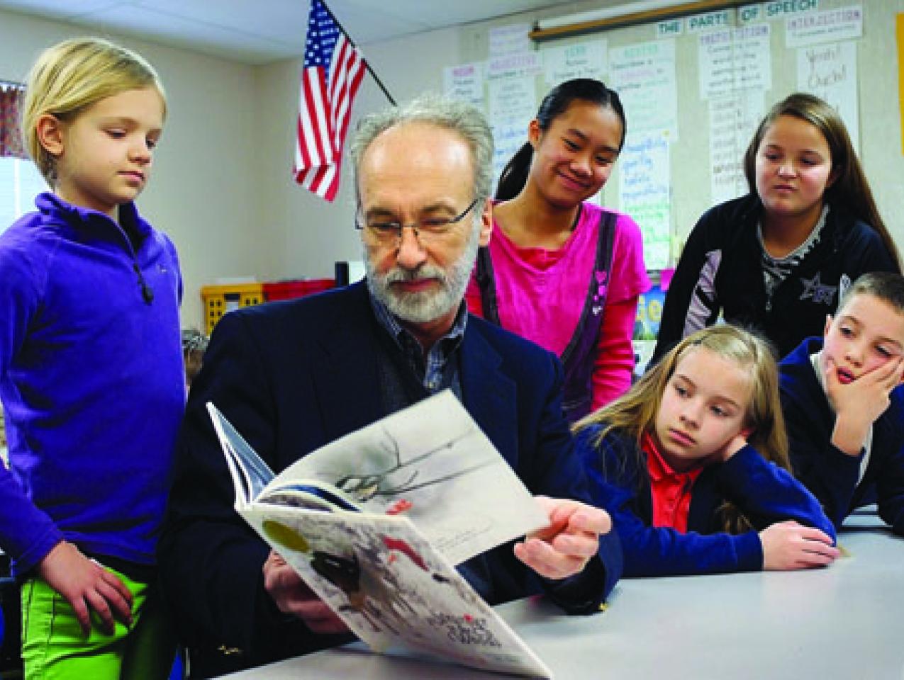 Huffman reading to schoolchildren