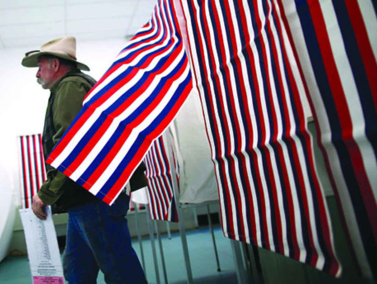 man leaves voting booth