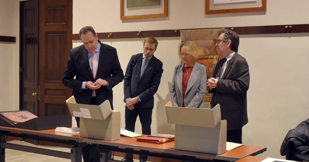 Latvian Ambassador delegation viewing library and archival material