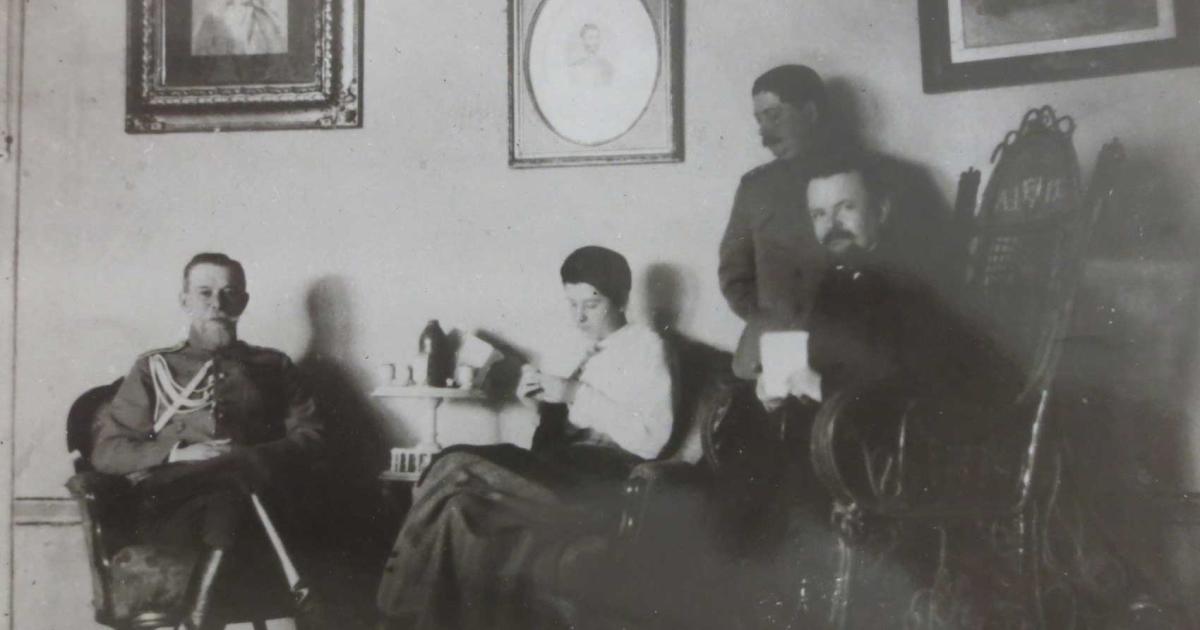 Trubetskoi with group in a sitting room