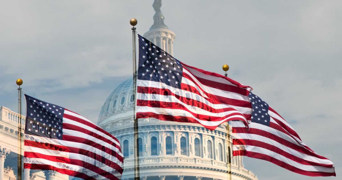 Capitol building with flags