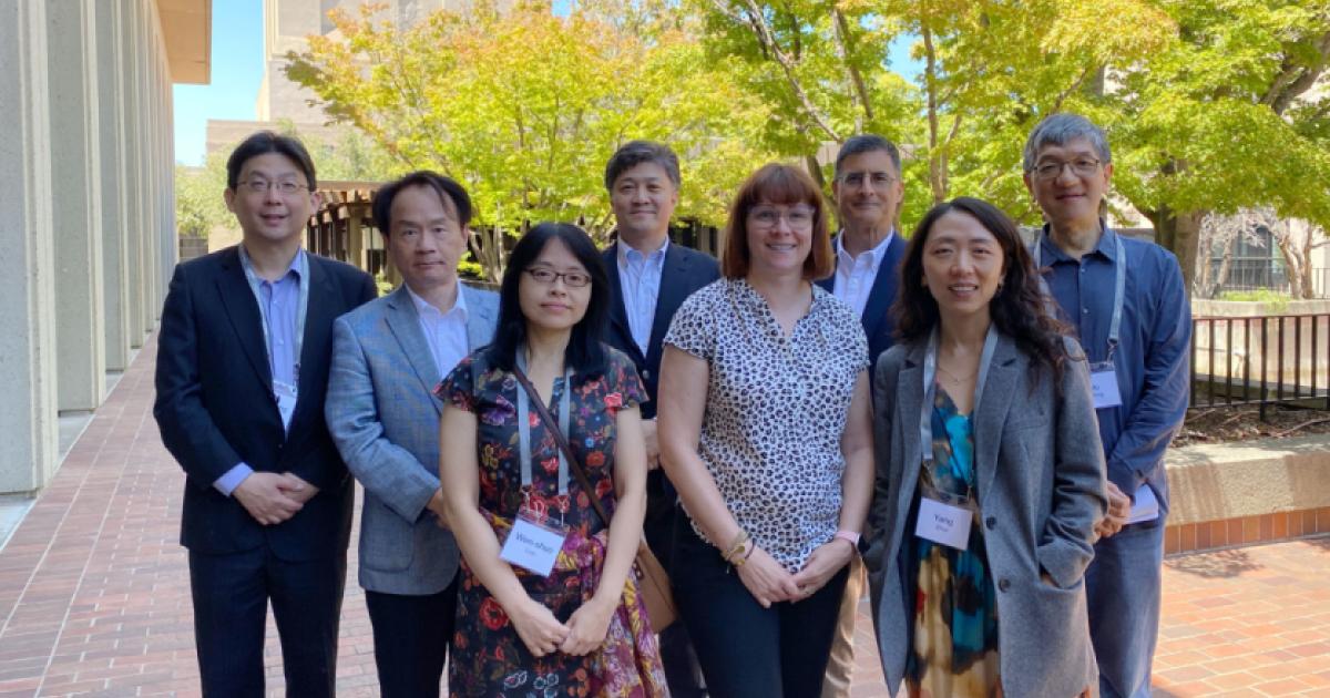 Modern China and Taiwan Workshop 2023 speakers stand in front of Hoover Tower and HHMB