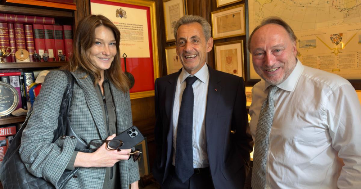 Carla Bruni, former French president Nicholas Sarkozy and Andrew Roberts are seen in London on June 4.