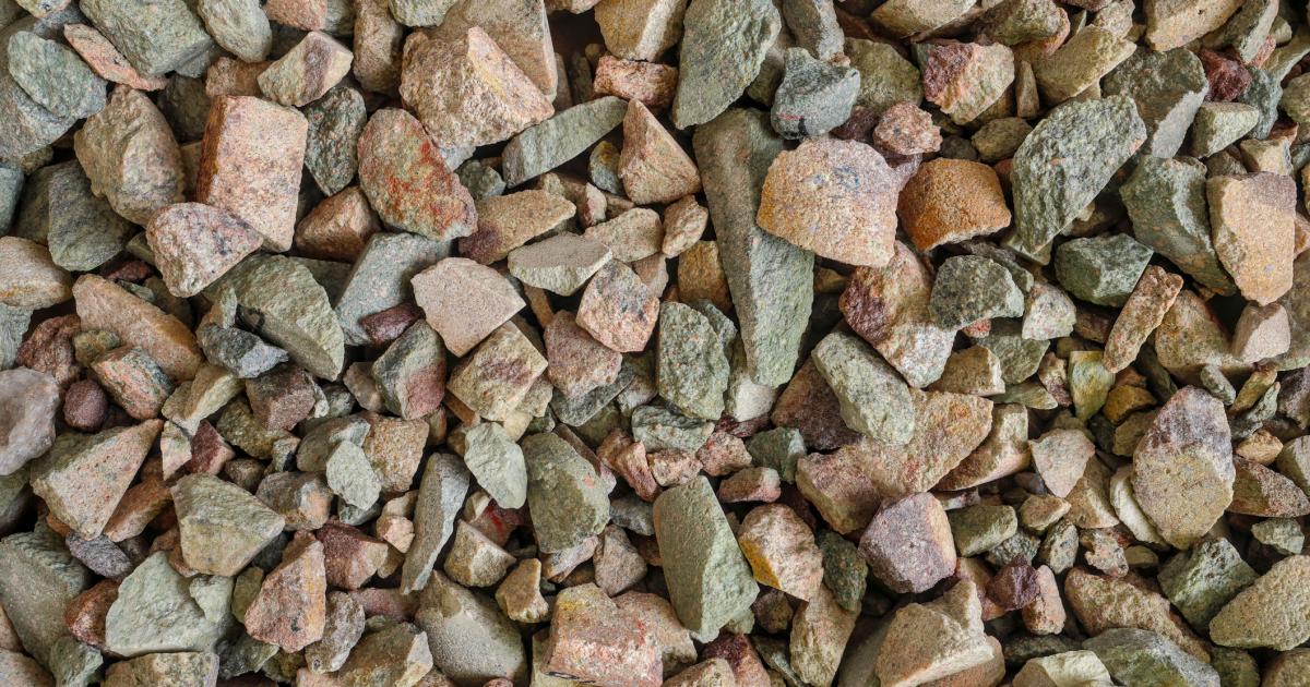 Rare earth (earths) element ore. Critical minerals, used in production of permanent magnets, aerospace alloys, specialty glass, electronic equipment, electric motors of hybrid and electric vehicles (EV), wind turbine generators. Background concept. - stock photo
