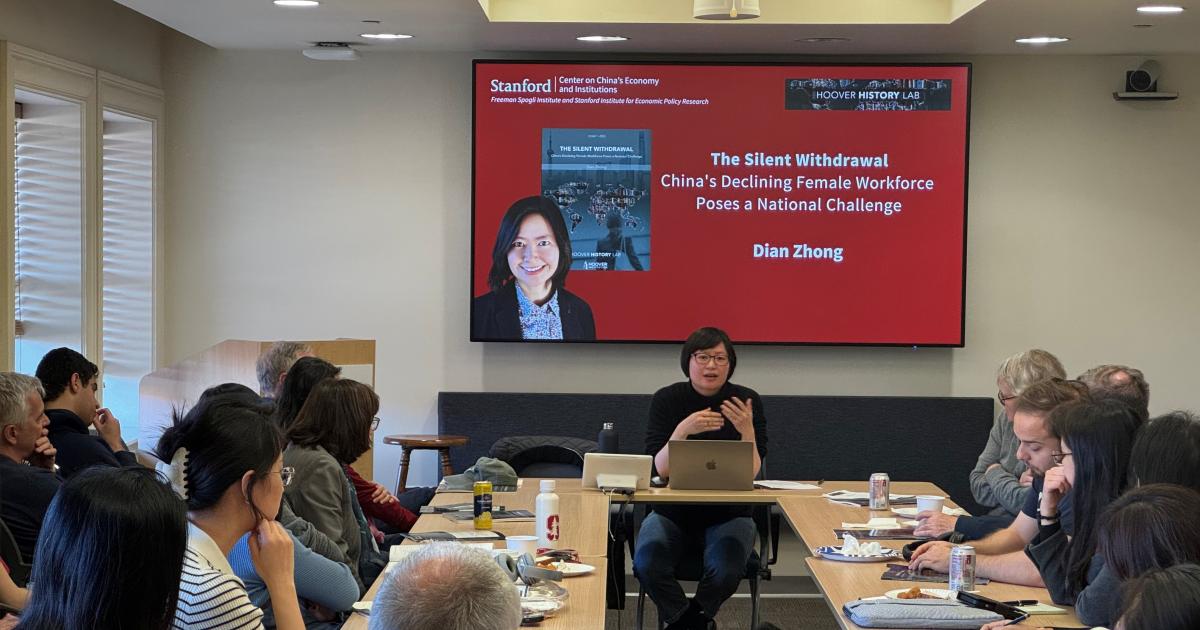 Dian Zhong speaking at an event