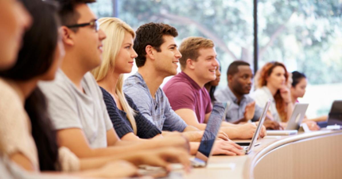 Class Of University Students Using Laptops In Lecture stock photo
