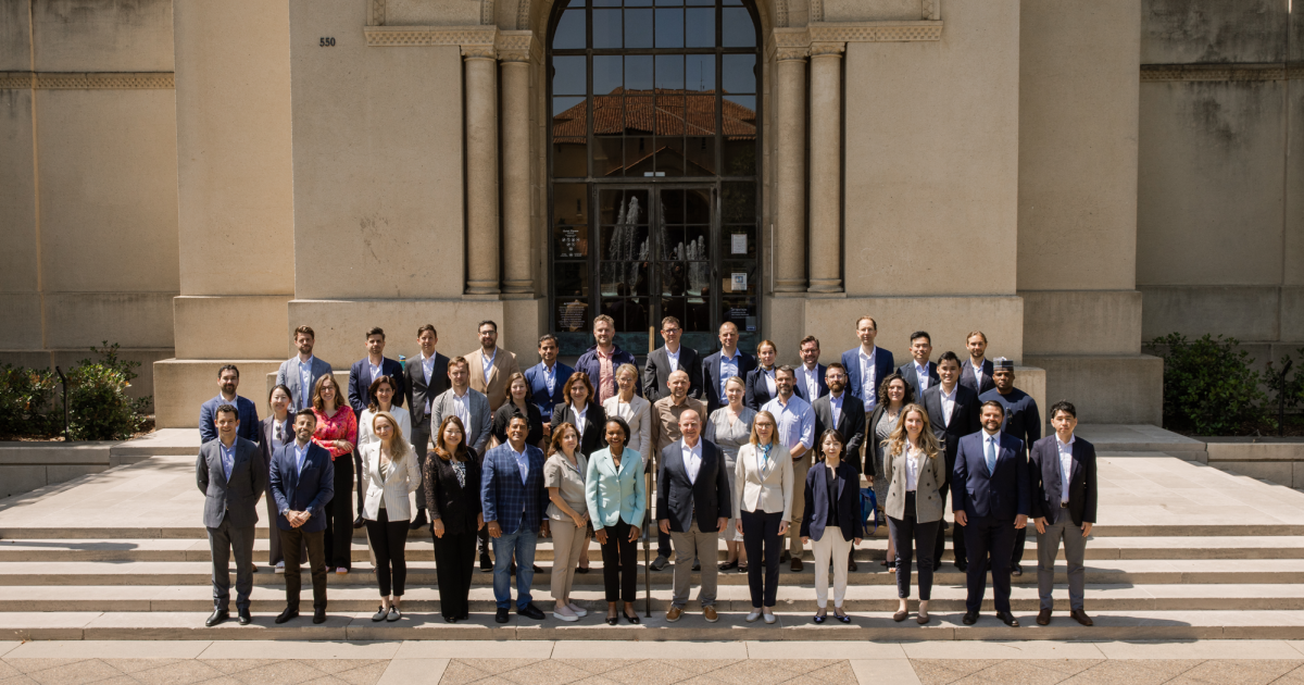 The 2025 cohort of Hoover Institution International Seminar participants are seen outside Hoover Tower with Condoleezza Rice and H.R. McMaster (center) on June 23, 2025. (Patrick Beaudouin)