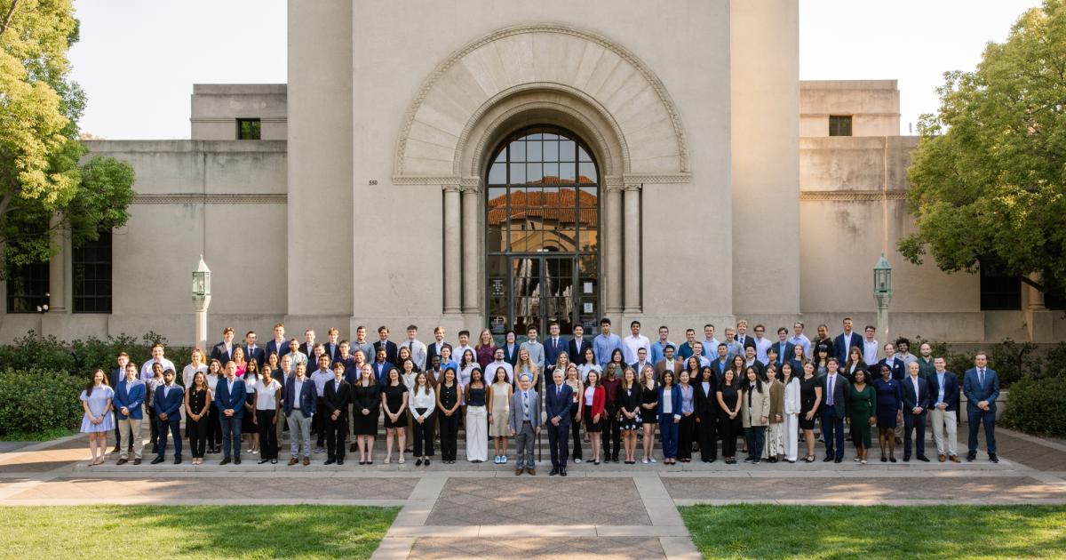 Students who participated in the 2025 Hoover Institution Summer Policy Boot Camp stand before Hoover Tower on August 10, 2025. (Patrick Beaudouin)