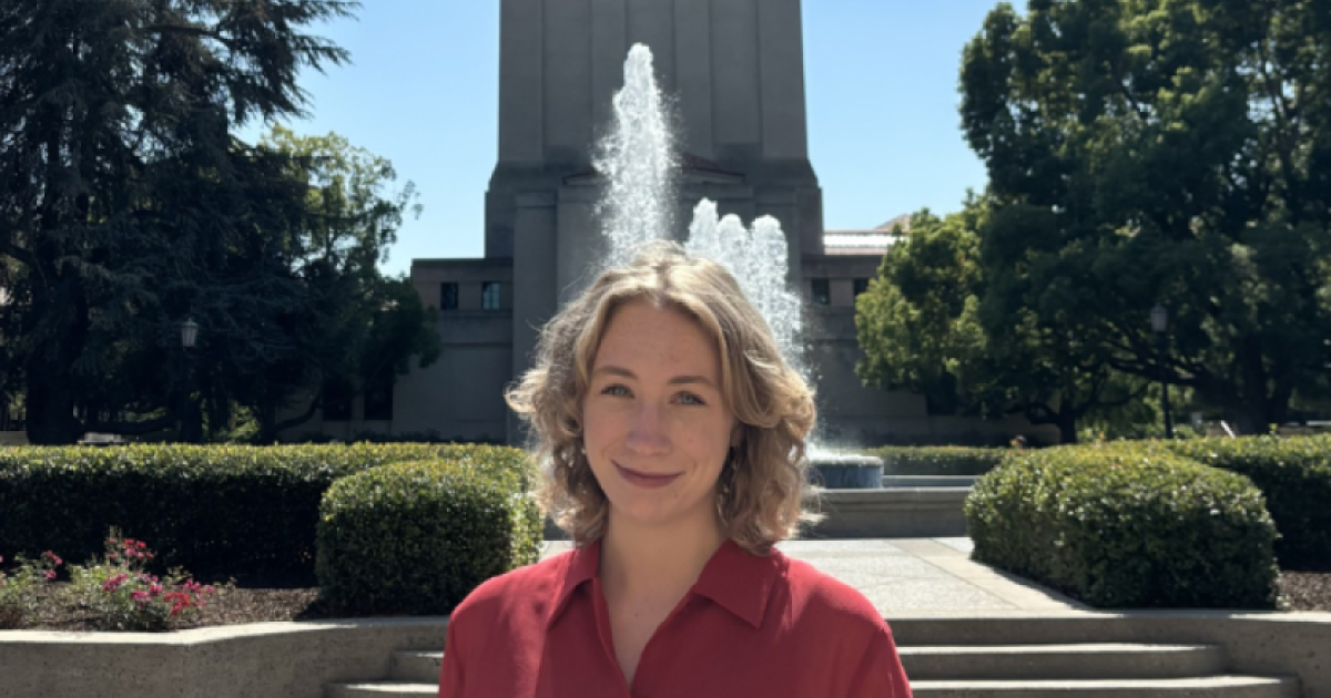 Jenna Mollerus in front of the Hoover Tower