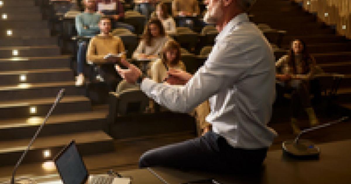 college professor with students istock image