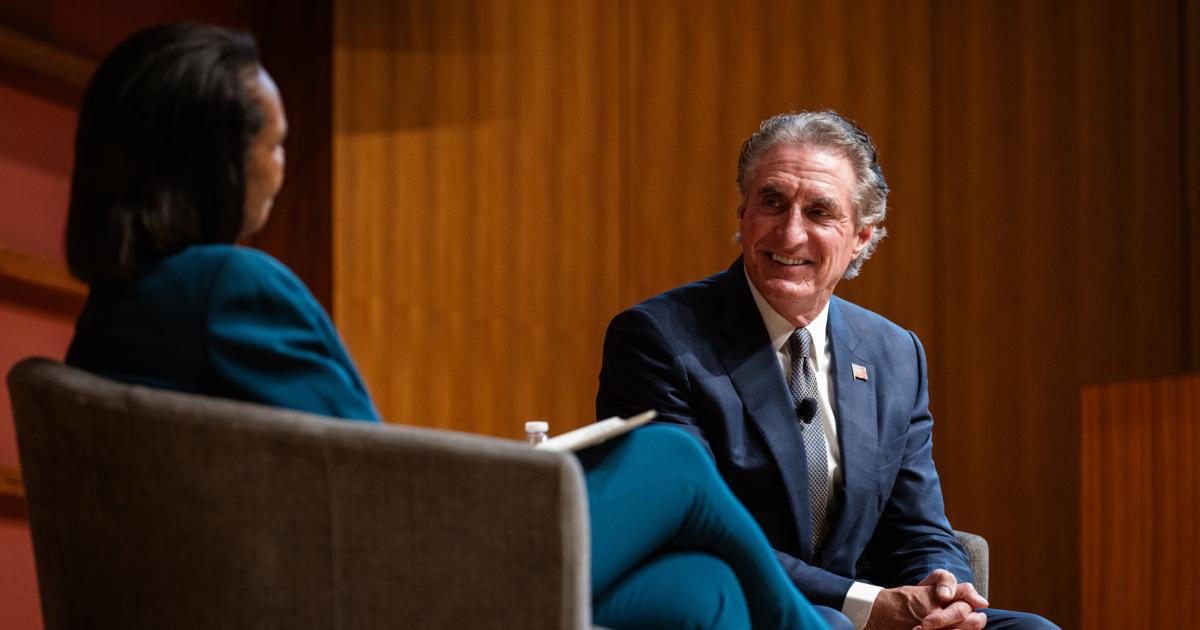 US Secretary of the Interior Doug Burgum is seen in Hauck Auditorium with Hoover Institution Director Condoleezza Rice on October 10, 2025. (Patrick Beaudouin)