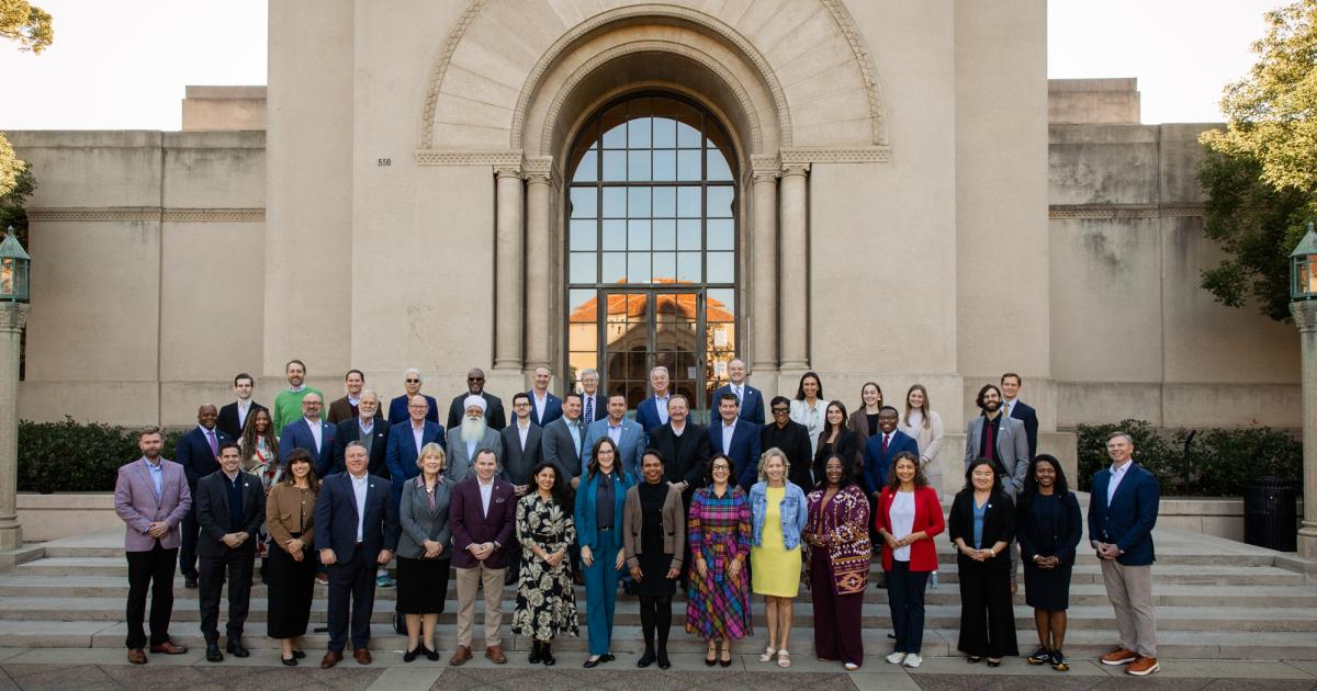 Participants in a joint Hoover–National Association of Counties gathering stand in front of Hoover Tower on December 8, 2025. (Patrick Beaudouin)